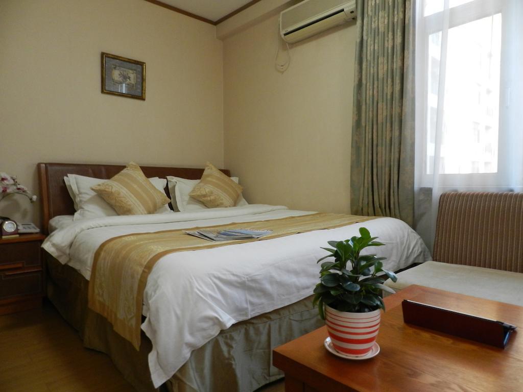Citadines Gugeng Dalian Aparthotel Стая снимка